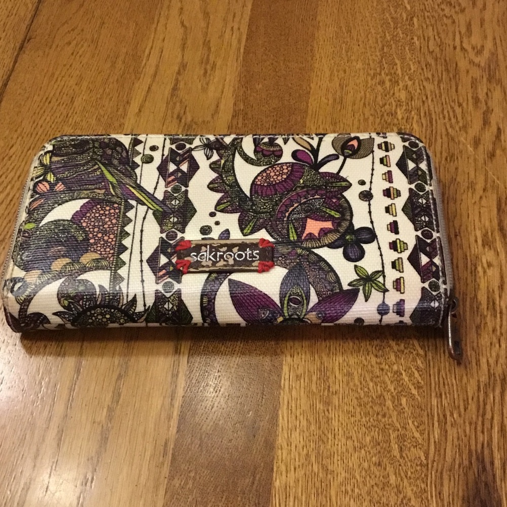 Woman’s Sakroots large card wallet. Design with embroidered owl. Like new!